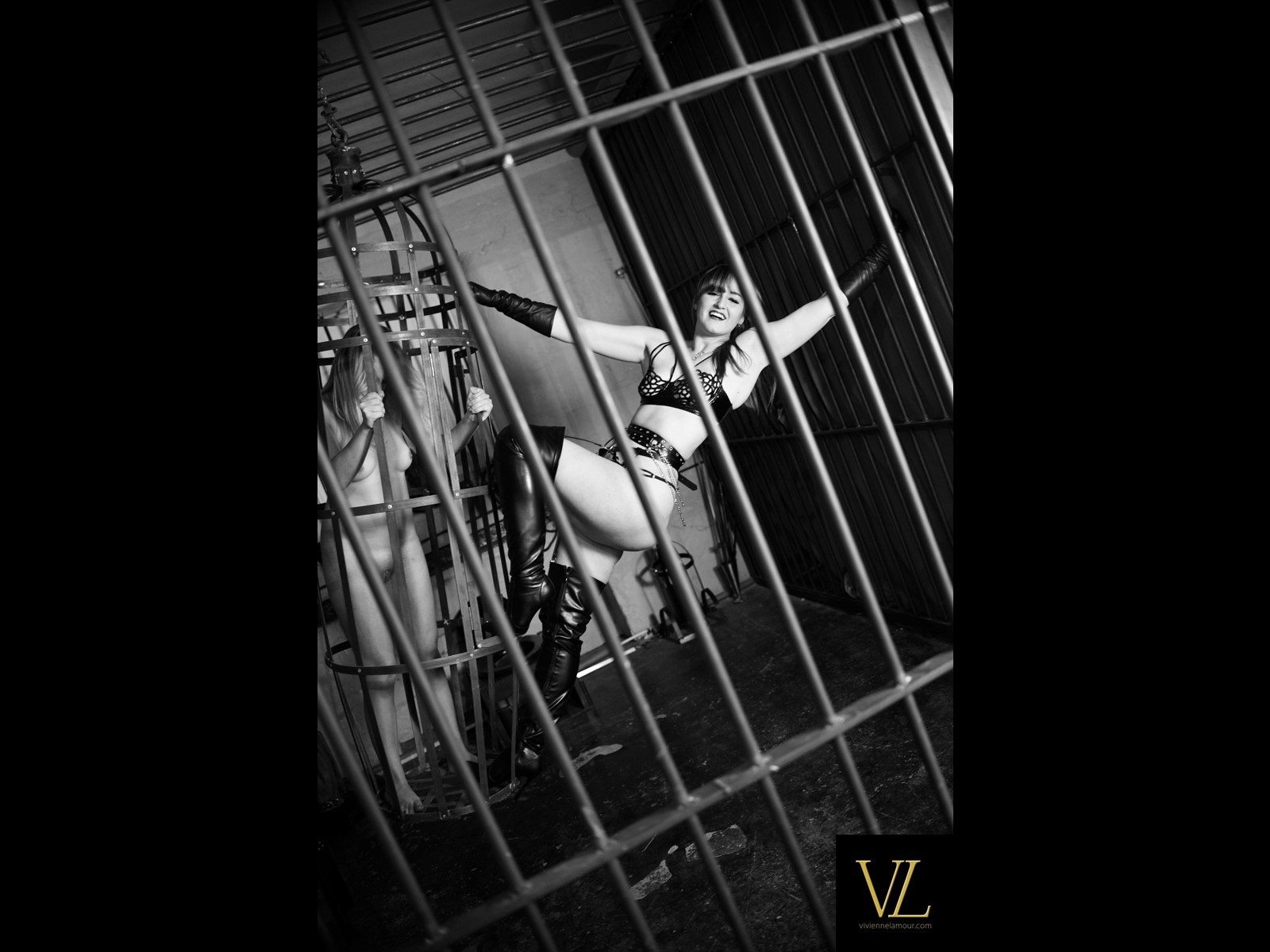 Tormenting the submissive female prisoner inside The Holding Cell at Celestial Studios Derby